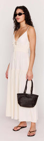 Cream Tie Front Tiered Maxi Dress displayed on a model, featuring a tie-front neckline and flowing skirt.