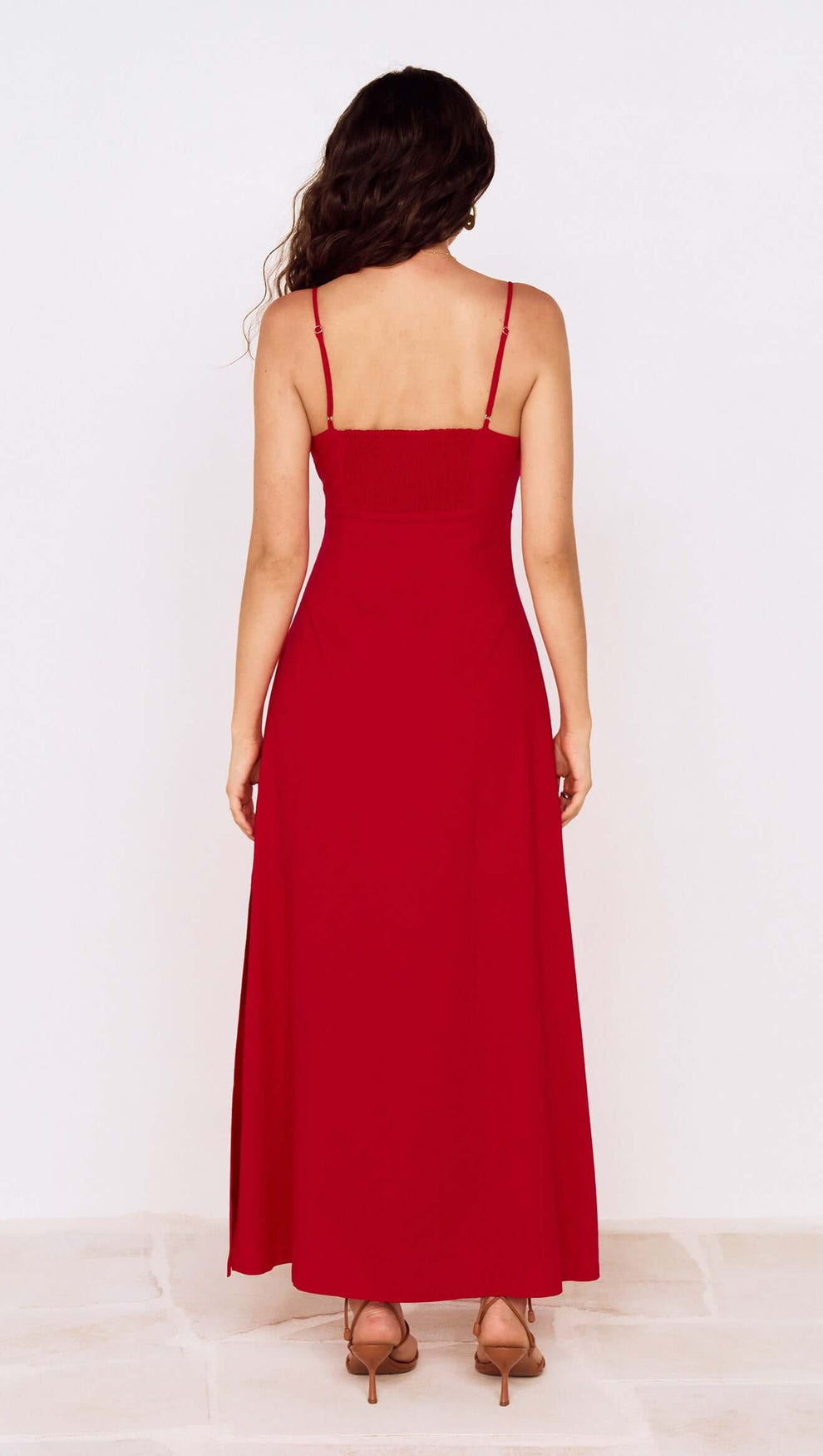 Back view of Deep Red Twist Front Maxi Dress featuring adjustable straps and a flowing silhouette.