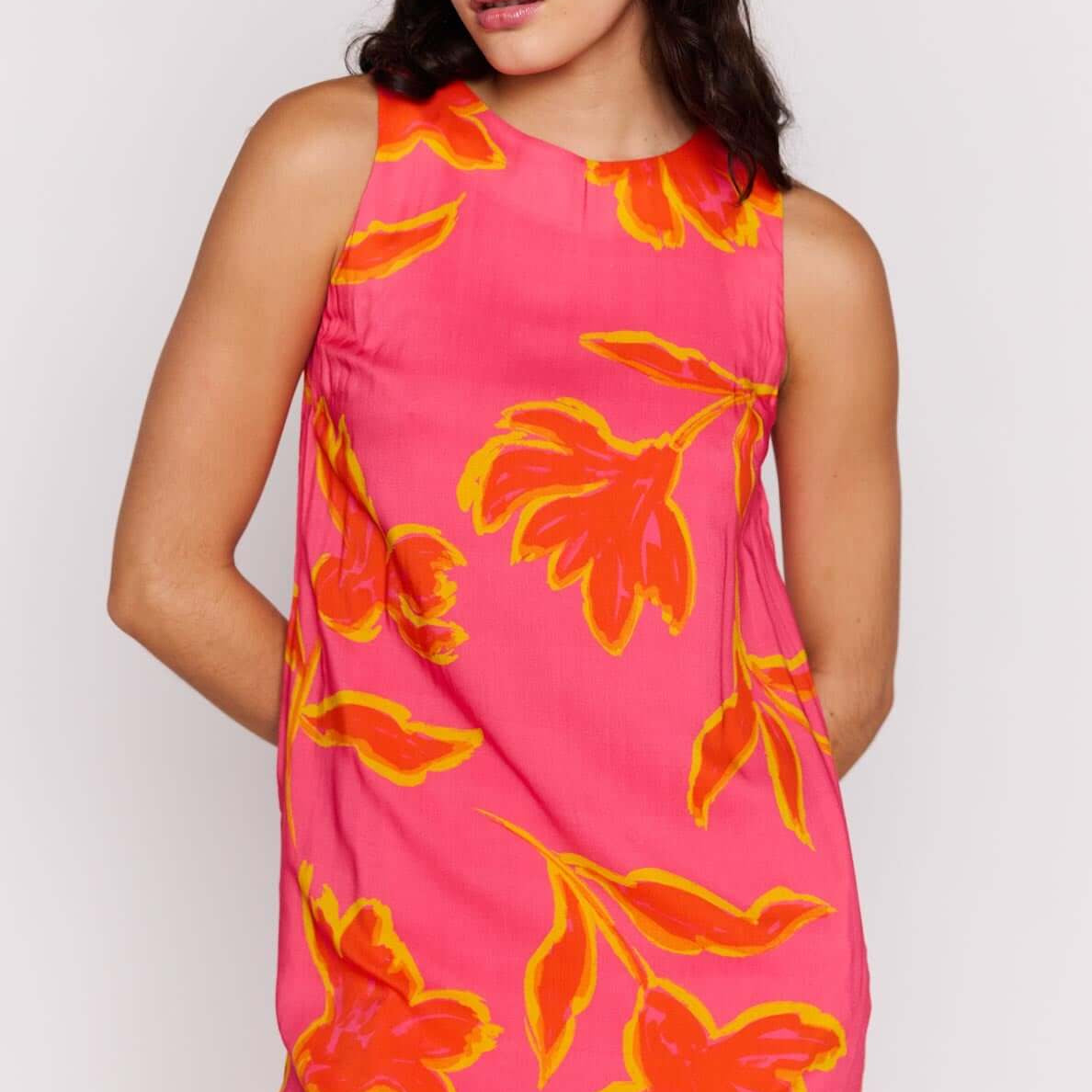ELODIE SHIFT MINI DRESS featuring vibrant floral patterns in pink and orange shades.