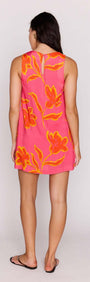 ELODIE SHIFT MINI DRESS in vibrant pink with floral design, showcasing a stylish back view on a model.