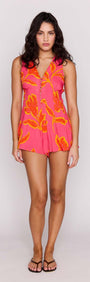 ELODIE SLEEVELESS PLAYSUIT in vibrant pink with floral patterns, perfect for summer outings.