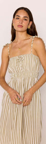 Olive & White Stripe Cotton Blend Maxi Dress on a model, featuring soft stripes, tie-front bodice and adjustable shoulder ties.