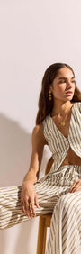 Woman wearing Olive & White Stripe Cotton Blend Vest paired with matching pants, showcasing a relaxed summer style.