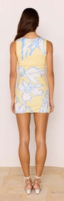 Yellow & Blue Floral Gathered Mesh Mini Dress back view on model, showcasing floral design and fitted silhouette.