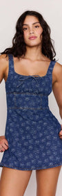 Floral Denim Mini Dress on a model showcasing the square neckline and flared skirt design.