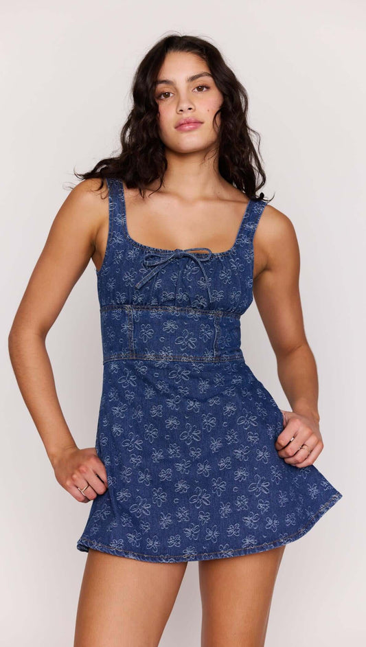 Floral Denim Mini Dress on a model showcasing the square neckline and flared skirt design.