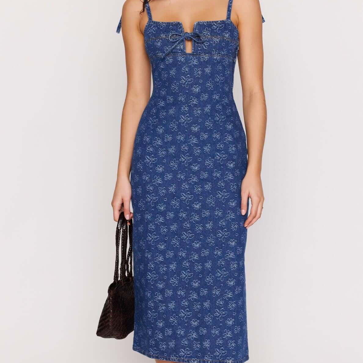 Model wearing the Floral Denim Stretch Midi Dress with a square neckline and floral pattern.
