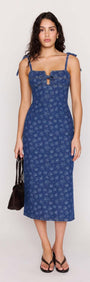 Model wearing the Floral Denim Stretch Midi Dress with a square neckline and floral pattern.