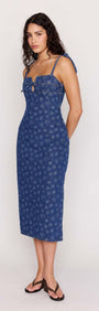 Model wearing Floral Denim Stretch Midi Dress with square neckline and floral pattern, perfect for sunny outings.