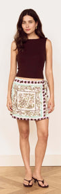 Model wearing a Floral Scarf Print Wrap Mini Skirt paired with a simple tank top.