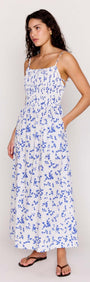 Blue Floral Cotton Backless Midi Dress on a model, featuring a delicate floral print and adjustable straps.