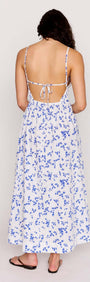 Back view of the Blue Floral Cotton Backless Midi Dress showcasing its beautiful floral print and adjustable straps.
