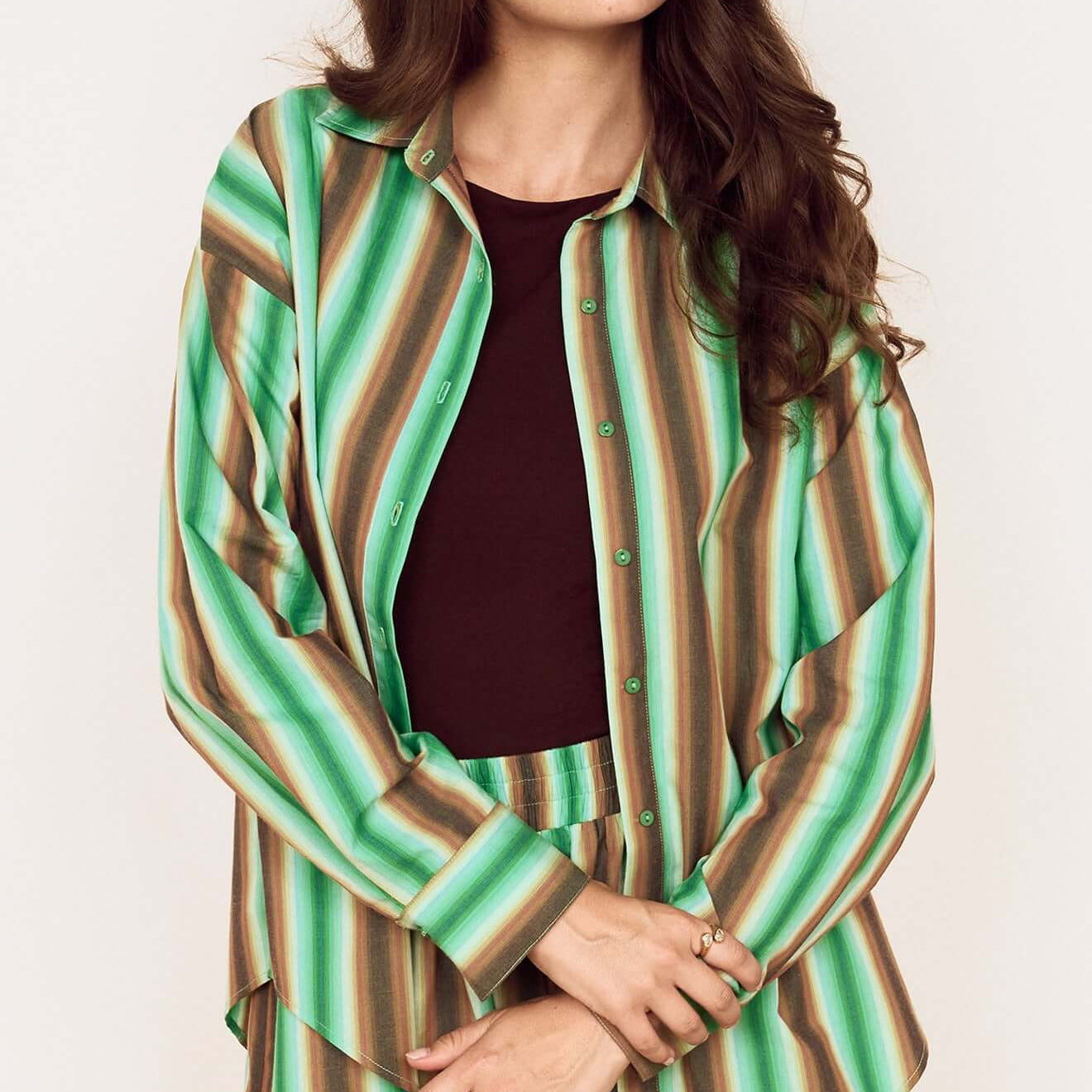 Model wearing the Green Stripe Cotton Oversized Shirt styled with matching shorts for a chic look.