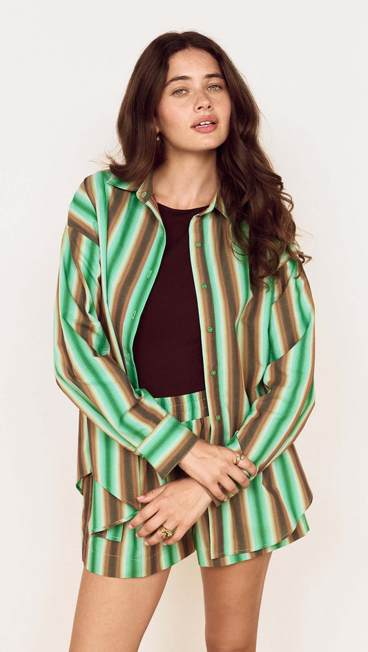 Model wearing the Green Stripe Cotton Oversized Shirt styled with matching shorts for a chic look.