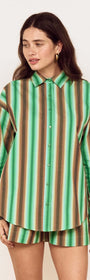 A model wearing the Green Stripe Cotton Oversized Shirt, featuring a vibrant painterly stripe print.
