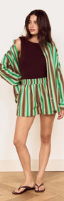 Model wearing a Green Stripe Cotton Oversized Shirt with matching shorts, showcasing a fresh summer style.