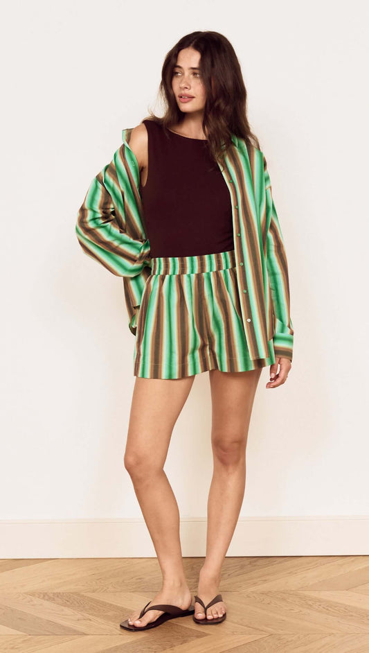 Model wearing a Green Stripe Cotton Oversized Shirt with matching shorts, showcasing a fresh summer style.