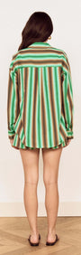 Back view of a model wearing the Green Stripe Cotton Oversized Shirt featuring a painterly stripe design.