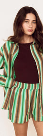 Model showcasing the Green Stripe Cotton Relaxed Short with matching shirt, perfect for summer styling.