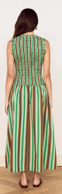 Back view of a woman wearing the Green Stripe Cotton Shirred Midi Dress, showcasing its unique stripe design and flattering silhouette.