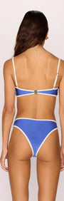 Model showcasing the HARLEY CONTRAST BIKINI BOTTOMS in blue and white from the back, highlighting stylish swimwear design.