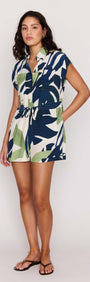 Leaf Print ECOVERO Playsuit worn by a model, showcasing its relaxed silhouette and bold botanical print.
