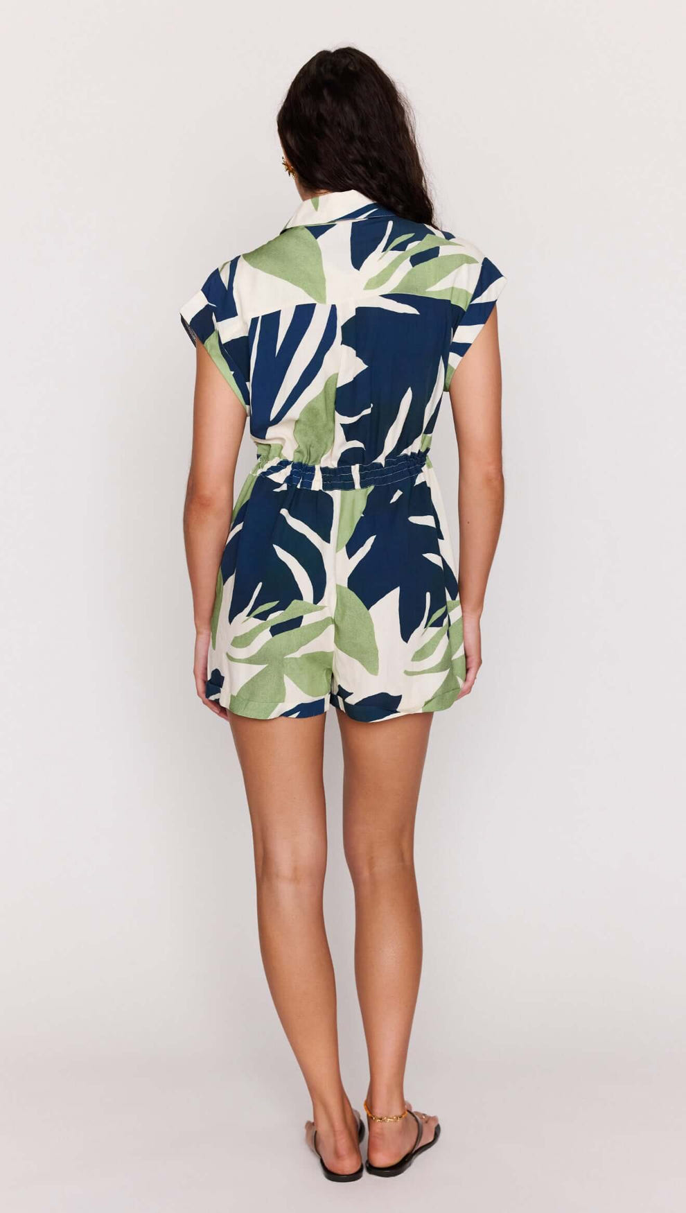 Back view of the Leaf Print ECOVERO Playsuit showcasing its relaxed silhouette and bold botanical design.