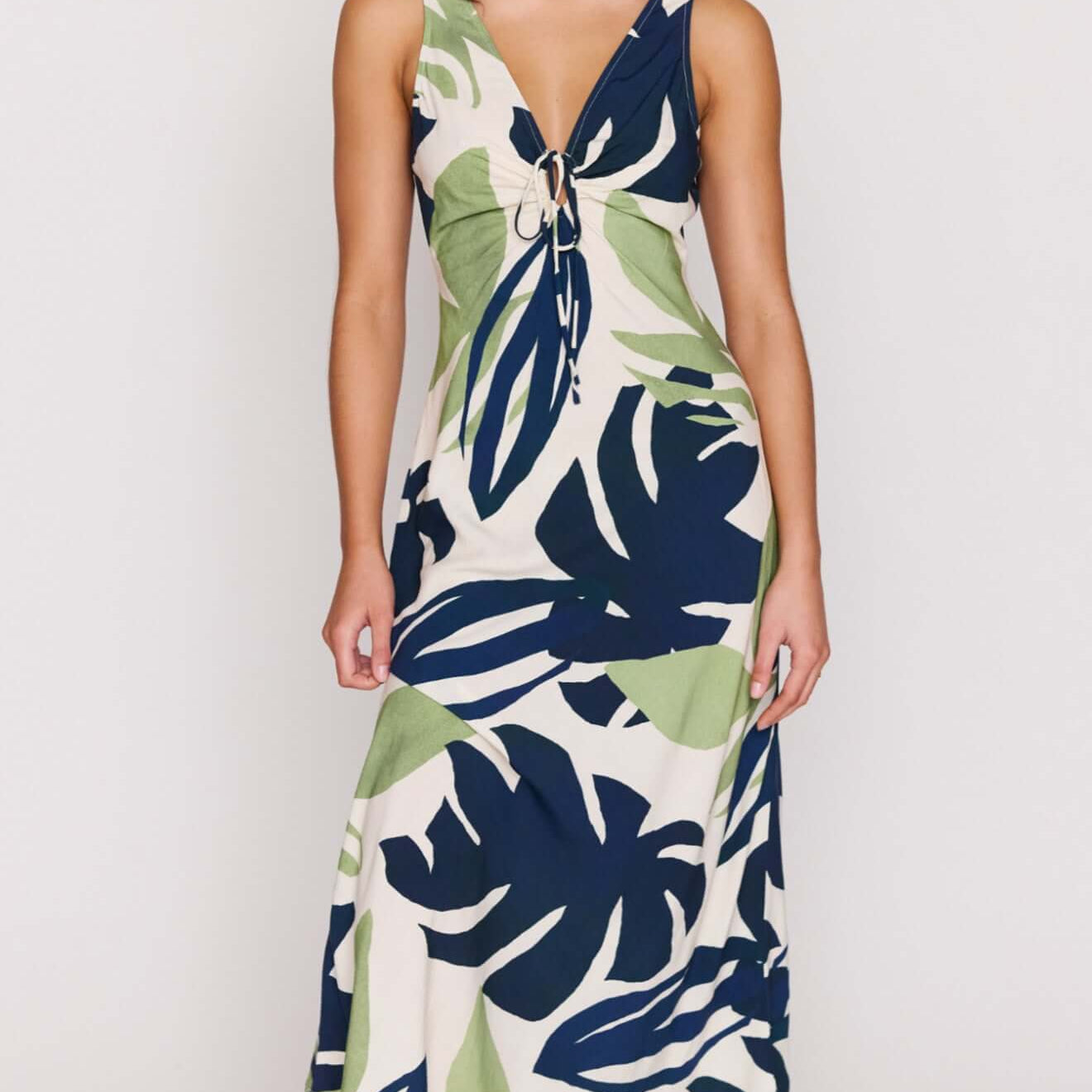 Leaf Print ECOVERO Tie Front Midi Dress featuring a soft V-neckline and adjustable tie detail with a vibrant botanical print.