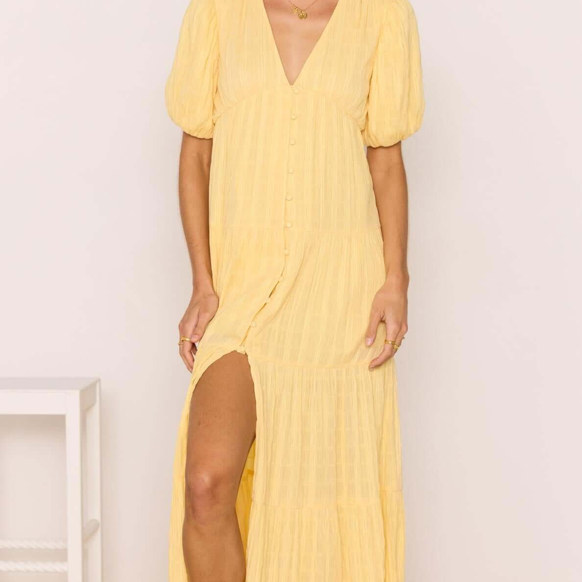 Relaxed Yellow Cotton Tiered Maxi Dress featuring a V-neckline and tiered skirt, perfect for sunny days.