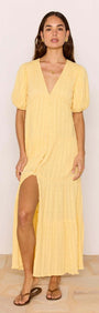 Relaxed Yellow Cotton Tiered Maxi Dress featuring a V-neckline and tiered skirt, perfect for sunny days.