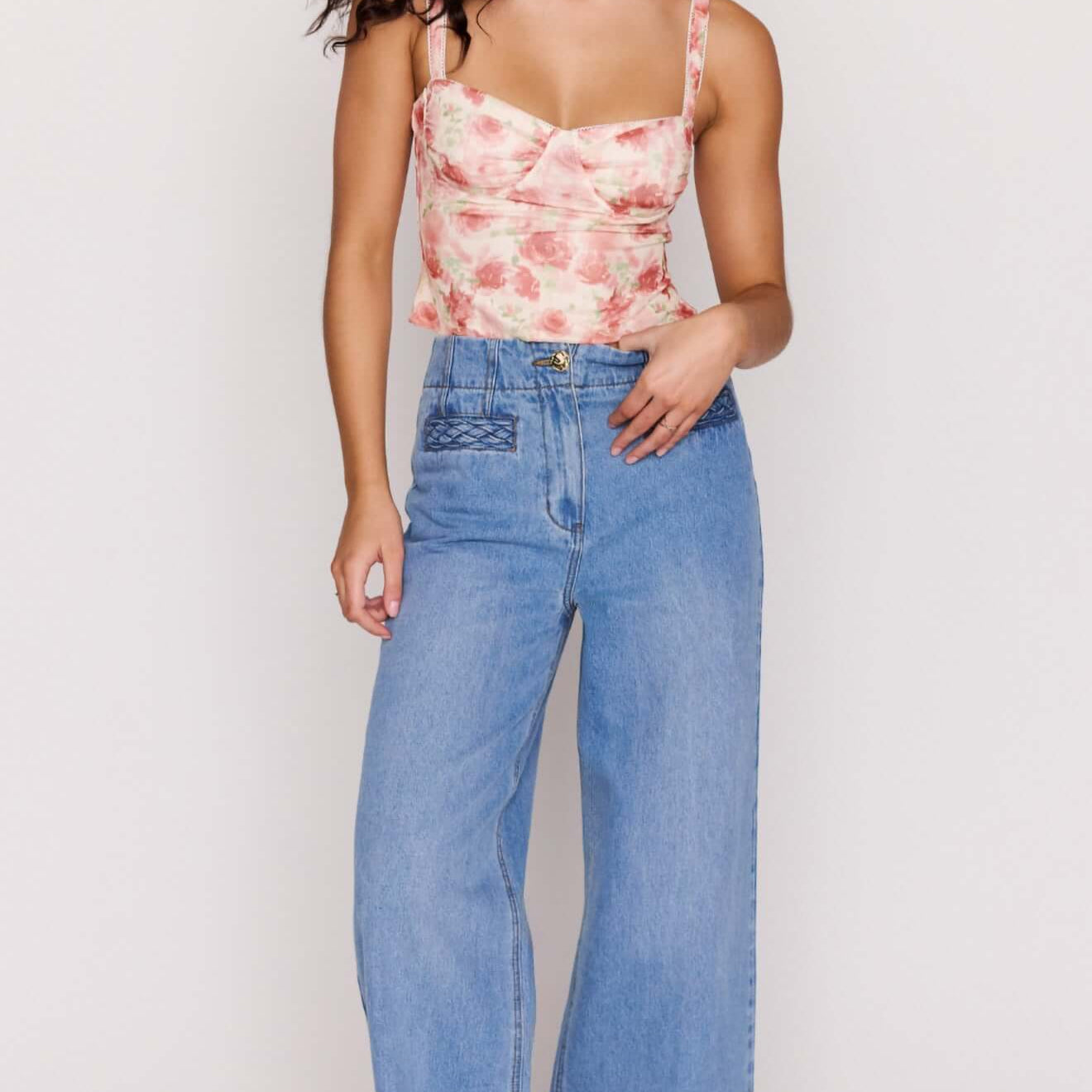 Model wearing Light Wash Straight Leg Denim Jeans with floral crop top and sandals.