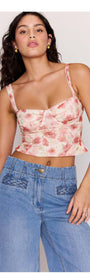 Model wearing a floral crop top with Light Wash Straight Leg Denim Jeans, showcasing a trendy and casual outfit.