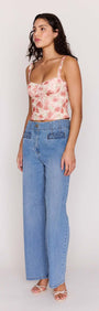 Model wearing Light Wash Straight Leg Denim Jeans with floral top, showcasing high-rise waist and straight-leg fit.