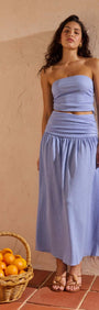 Model wearing Powder Blue Yoke Detail Maxi Skirt paired with matching strapless top, showcasing summer fashion.