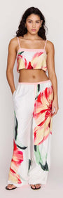 Model wearing Macro Floral Print Drawstring Pants paired with a floral crop top, showcasing a vibrant summer look.