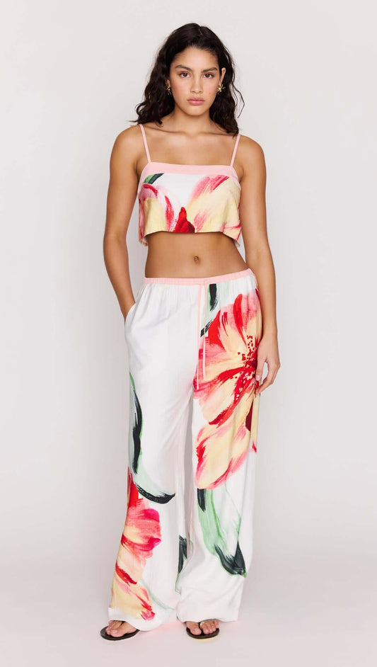 Model wearing Macro Floral Print Drawstring Pants paired with a floral crop top, showcasing a vibrant summer look.