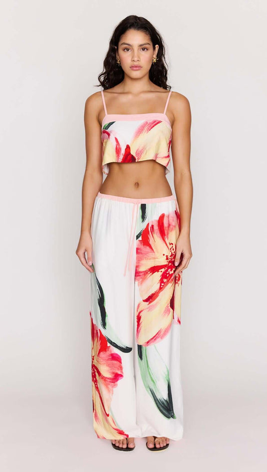 Model wearing Macro Floral Print Drawstring Pants with a matching cropped top showcasing vibrant floral patterns.