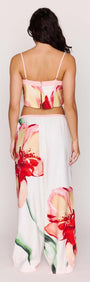 Model wearing Macro Floral Print Drawstring Pants with floral design and stylish crop top from the back.