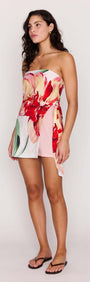 Model wearing a Macro Floral Print Strapless Mini Dress with vibrant flowers and a stylish design.