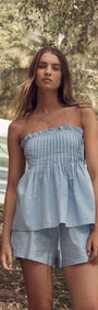 Cotton Linen Blend Blue Pintuck Top worn with matching shorts in a summer setting.