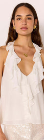 Model wearing a White Ruffle Halter Top with cascading ruffles and a flattering neckline for a feminine look.