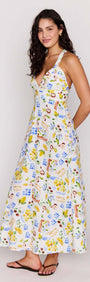 A model wearing the Mediterranean Print Halter Midi Dress, showcasing its flattering V-neckline and vibrant floral print.