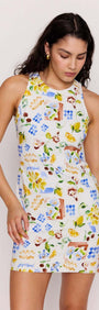 Model wearing a Mediterranean Print Open Back Mini Dress with vibrant citrus and floral patterns.