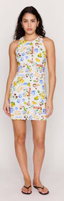 Model wearing Mediterranean Print Open Back Mini Dress featuring vibrant citrus and floral patterns.