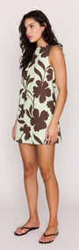Mint Chocolate Cotton Floral Low Back Shift Dress worn by a model showcasing its floral design and sleeveless style.