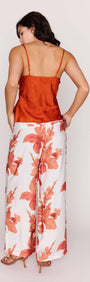 Model showcasing Orange Bead Detail Satin Cami paired with floral wide-leg pants from the back view.