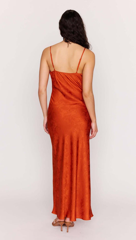 Back view of the Orange Bead Detailed Satin Bias Midi Dress showcasing its sleek satin design and adjustable straps.