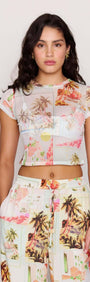 Model wearing a Palm Print Cropped Mesh Tee with vintage postcard print and matching bottoms.