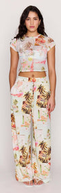 Model wearing Palm Print Cropped Mesh Tee with wide-leg pants featuring vintage postcard print.
