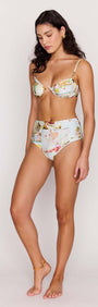 Model showcasing Palm Print High Waisted Bikini Bottoms paired with a matching bra top in a stylish pose.